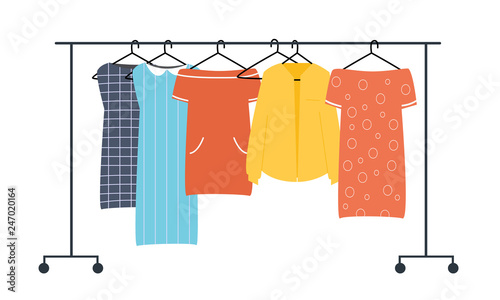 Colorful clothes hanging on the hanger. Women's clothing is stored on an open hanger. 