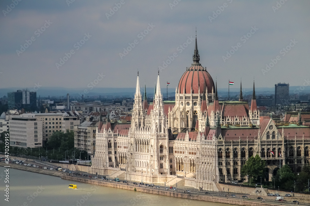 The Hungarian Parliament, illuminated by the sun, in the city of Budapest on the Danube river