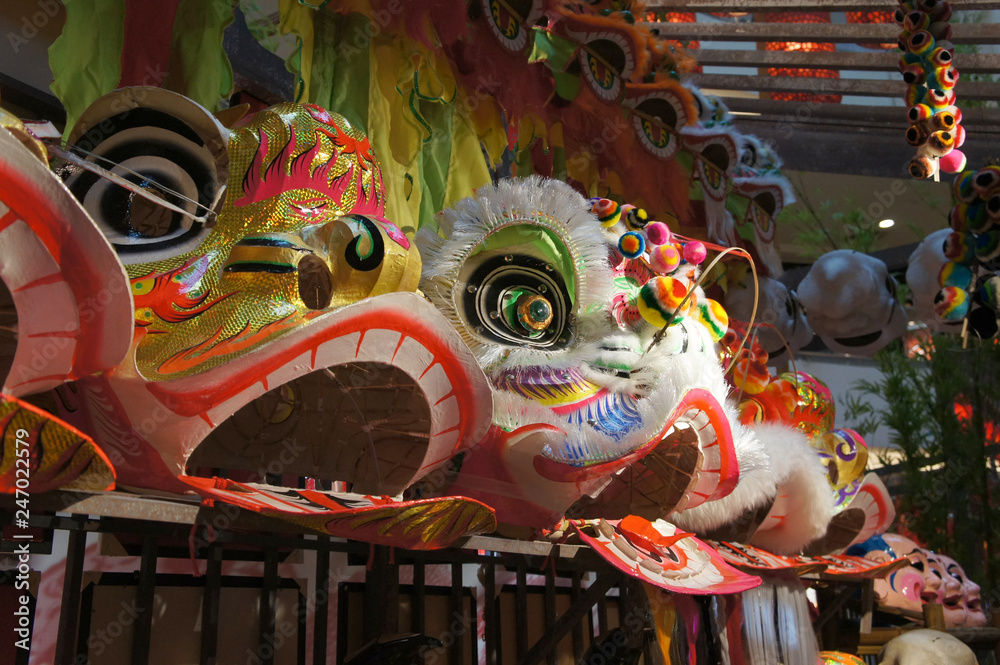 Chinese tradition lion mask or lion head displayed on rack. It is used to performed lion dance during Chinese New Year Festival.   