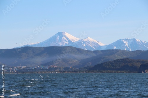 Avachinsky and Kozelsky volcanoes towers over the city of Petropavlovsk-Kamchatsky on the Kamchatka Peninsula, Russia