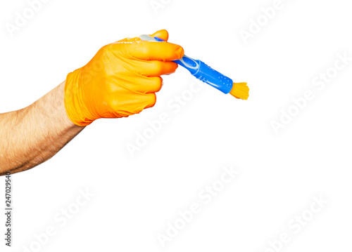 Washing concept. A male man hand with brush isolated on white background. Worker cleaning. Cleaning with cloth, foam and brush. Cleaning concept. Hand in orange protective rubber glove