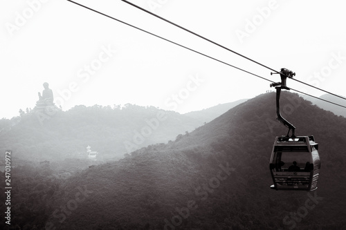 Cable car to Ngong Ping in Hong Kong with the Tian Tan Buddha in the background at the Lantau Island