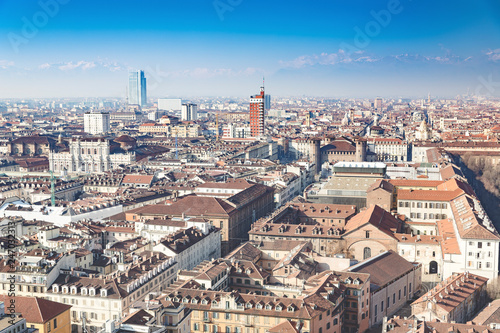 Overview of the city of Turin, seen from the top of the "Mole Antonelliana". Sunny day in winter with light atmospheric pollution.