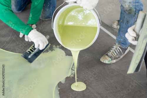 Construction series: Workers working on epoxy floor