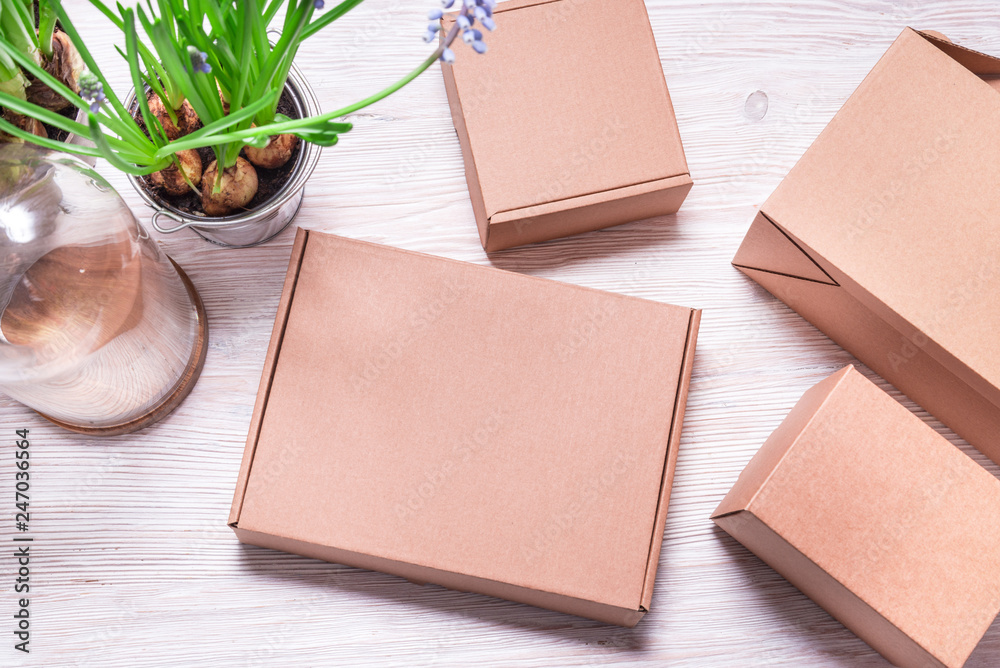 Fototapeta premium Cardboard boxes on wooden table
