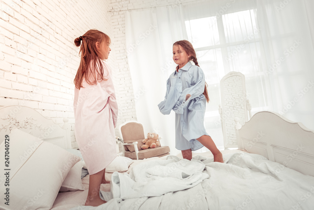 Obraz premium Cute pretty girls being in their dads shirts