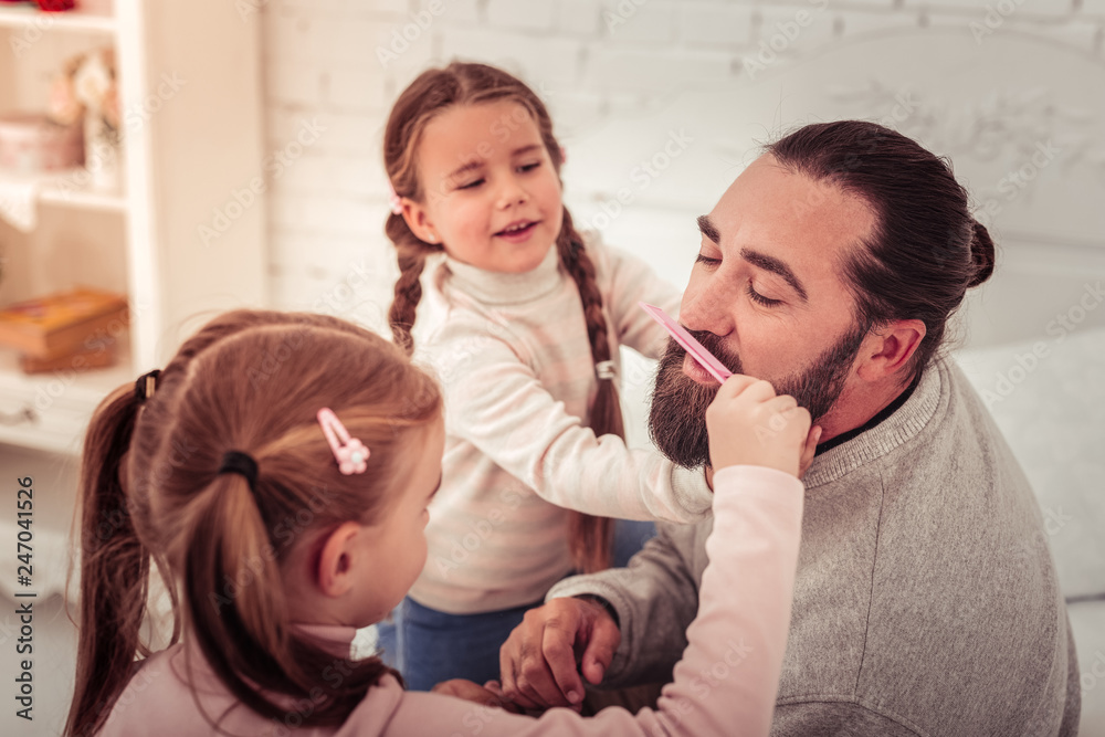 Nice bearded man having his beard groomed Nice bearded man having his beard groomed