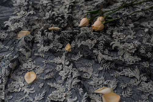 The texture of lace on wooden background decoreted roses. photo