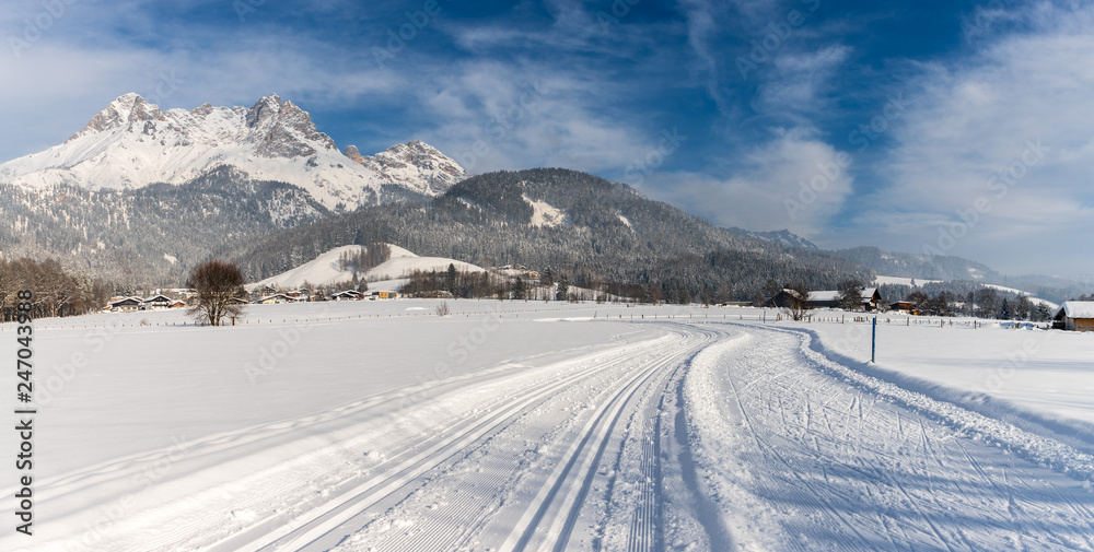 Cross-country skiing in Austria: Slope, fresh white powder snow and mountains