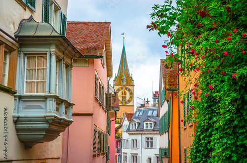 Obraz na płótnie Beautiful cozy street and tower of Saint Peter church in the city center of Zurich, Switzerland w salonie