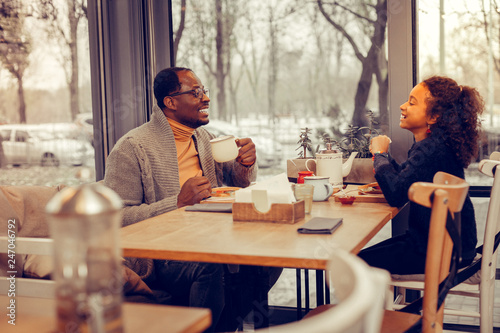 Father and daughter feeling memorable while joking together