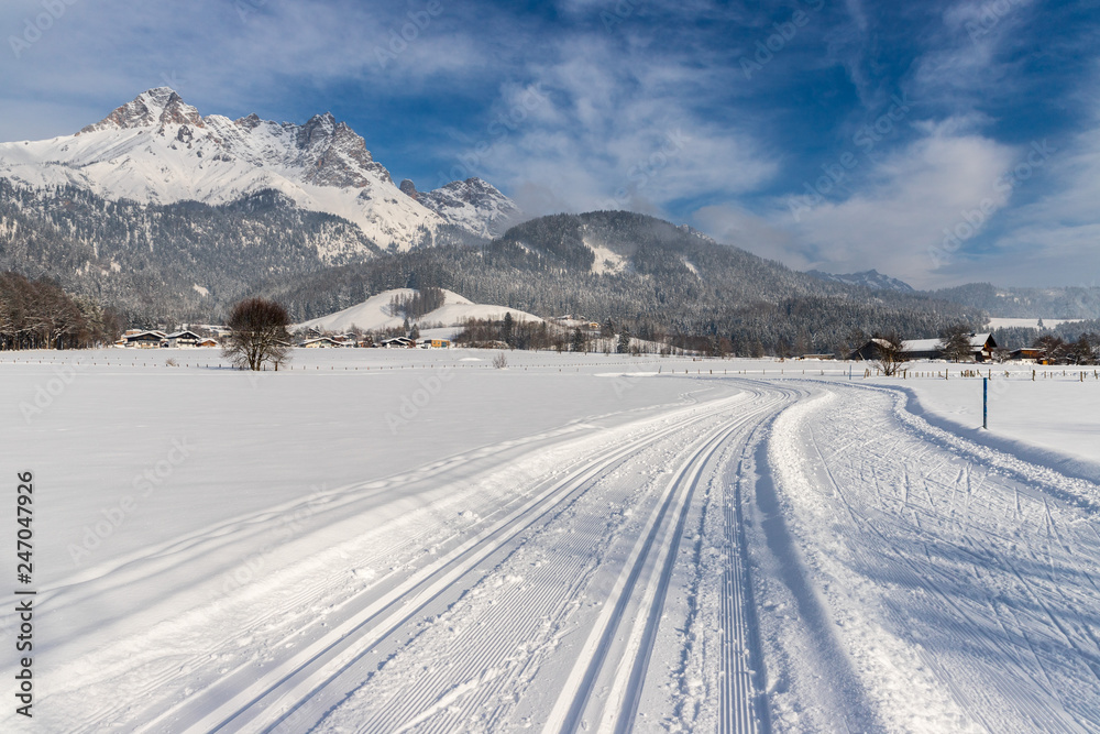 Cross-country skiing in Austria: Slope, fresh white powder snow and mountains Cross-country skiing in Austria: Slope, fresh white powder snow and mountains