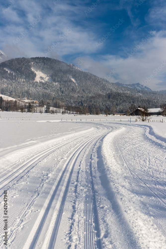 Cross-country skiing in Austria: Slope, fresh white powder snow and mountains Cross-country skiing in Austria: Slope, fresh white powder snow and mountains