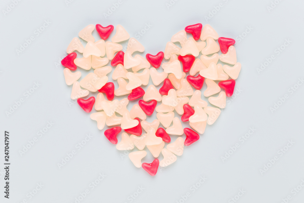 Valentines day background pastel hearts on blue wooden background. Valentines day background pastel hearts on blue wooden background.