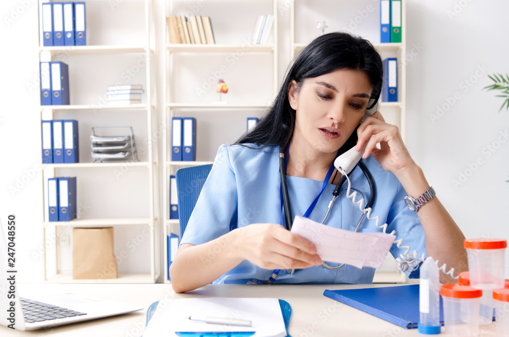 Female doctor cardiologist working in the clinic Female doctor cardiologist working in the clinic