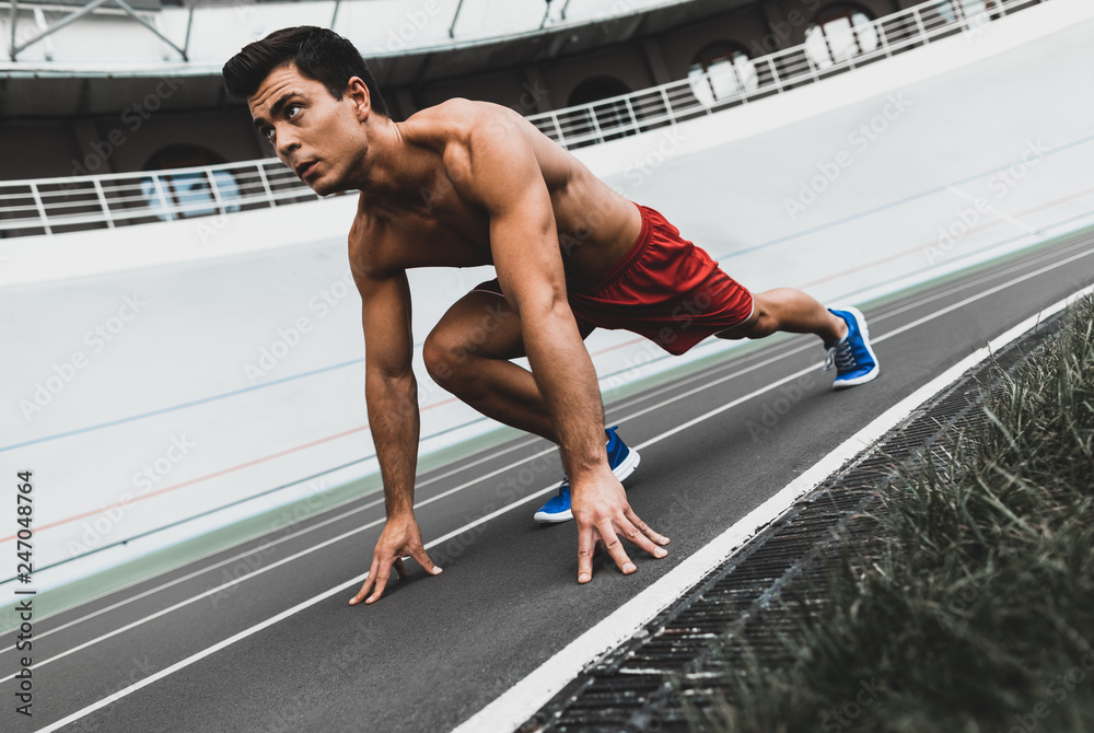 Fototapeta premium Serene man wearing sport clothes during training