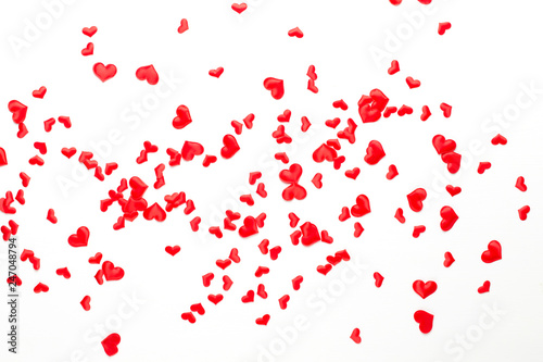 Valentines day background red hearts on wooden background.