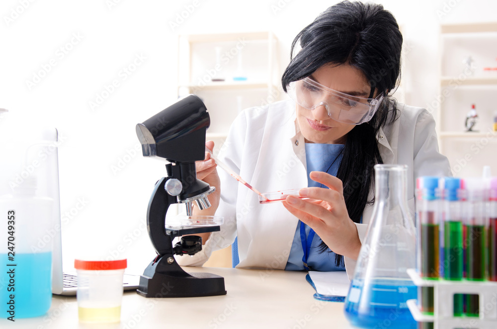 Female chemist working at the lab Female chemist working at the lab