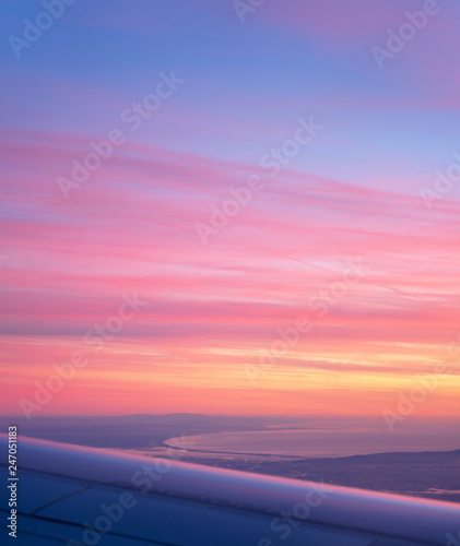 Fototapeta Naklejka Na Ścianę i Meble -  Aerial view of Comporta Troia bay from the plane, beautiful purple sunset