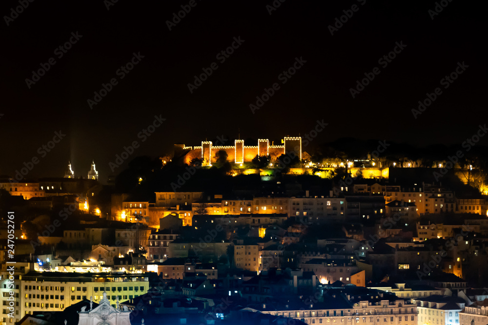 Saint George Castle at night, moorish citadel an the top of Lisbon, Portugal