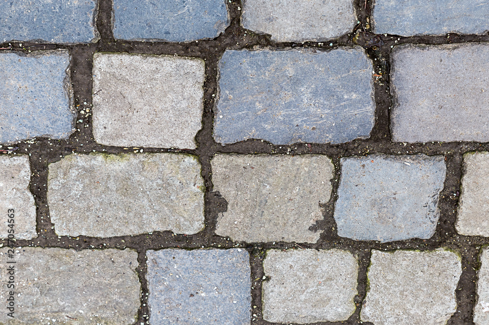 Fototapeta premium stone surface many cobblestone lines cement rectangular light beige gray pattern weathering hard surface