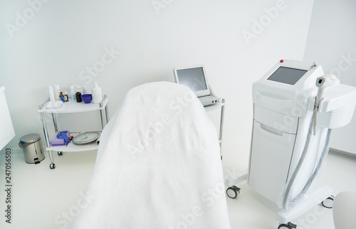 Interior of cosmetologist cabinet with modern equipment for epilation © Yakobchuk Olena