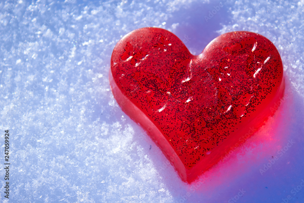 Beautiful red heart in the snow. Handmade soap in the shape of a heart. Love and Valentine's Day concept. Romantic background with free space for text. Beautiful red heart in the snow. Handmade soap in the shape of a heart. Love and Valentine's Day concept. Romantic background with free space for text.