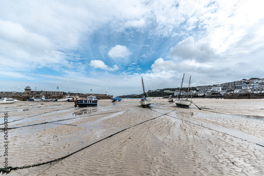 Boats at low tide in Cornwall, UK