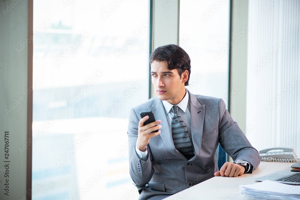 Young successful businessman working at the office Young successful businessman working at the office