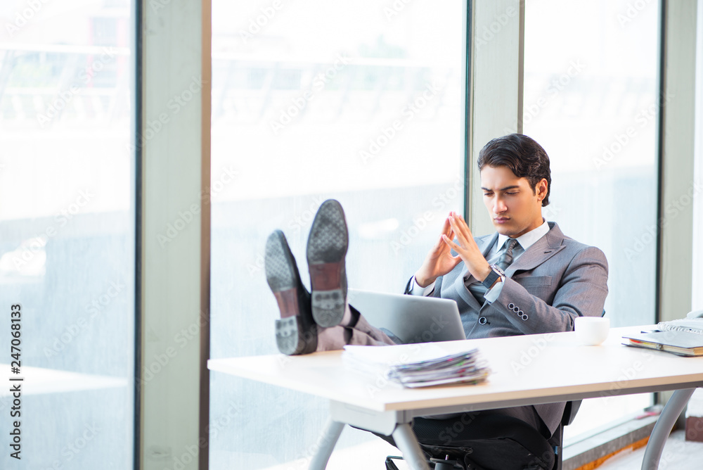 Young successful businessman working at the office Young successful businessman working at the office