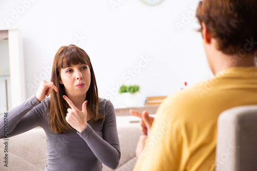 Woman and man learning sign language