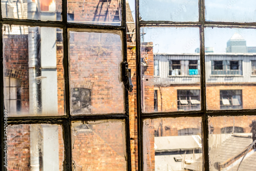 Old, rusty, open window in the old factory, UK