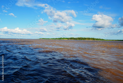 Meeting of Waters. Manaus, Amazonas, Brazil. Rio Negro river and its beauties that enchant to all visitors. Amazonia, the living nature. 