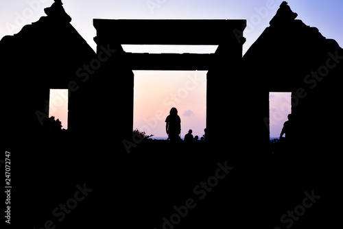 Silhoutte of old ancient temple royal palace ruins during sunset for people taking selfie