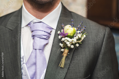 A grooms buttonhole corsage photo