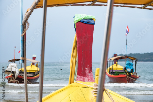 Colourful boats on the sand beach in Phuket, Thailand