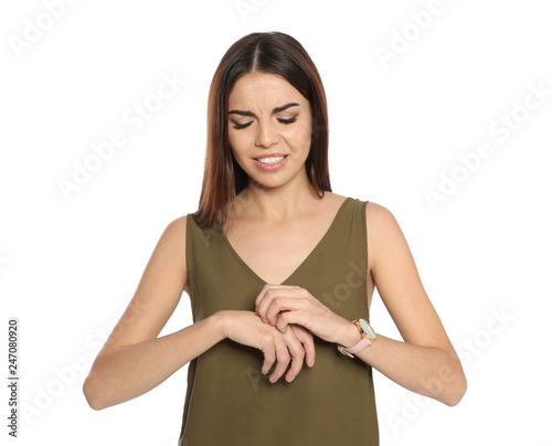 Young woman scratching hand on white background. Annoying itch © New Africa