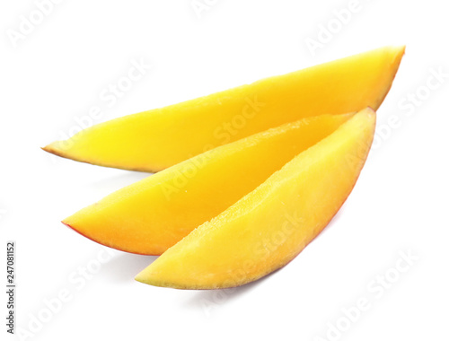 Slices of delicious ripe mango on white background