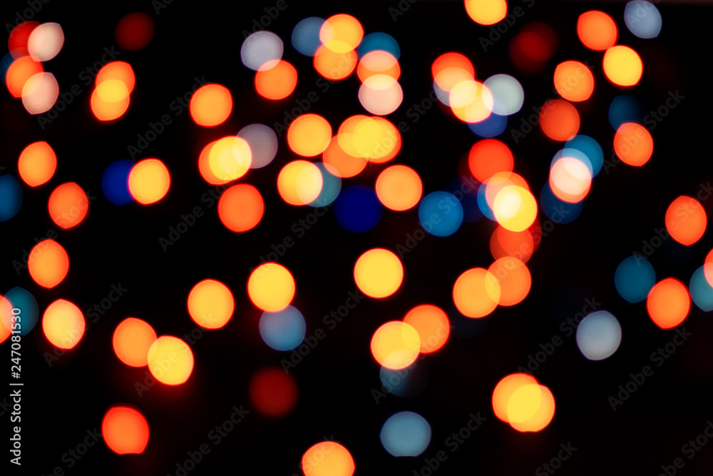 Abstract multicolor bokeh texture on black background. Defocused sparkles. Abstract multicolor bokeh texture on black background. Defocused sparkles.