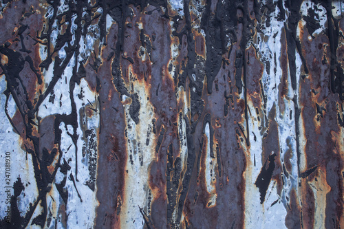 Old zincked ferrous sheet with a blight and Ð¿Ð¾Ñ‚ÐµÐºÐ°Ð¼Ð¸ of petroleum tar photo