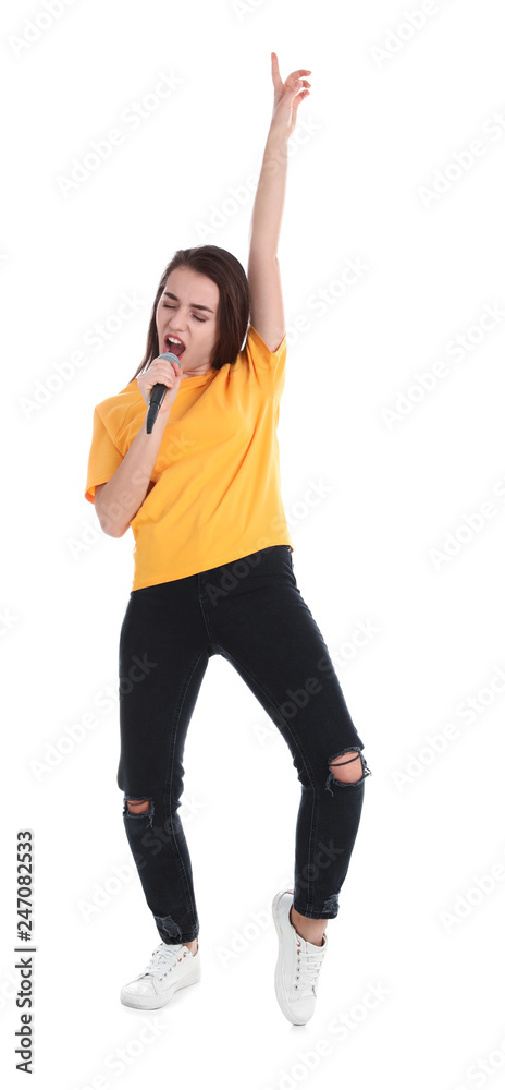 Young woman wearing casual clothes singing in microphone on white background Young woman wearing casual clothes singing in microphone on white background