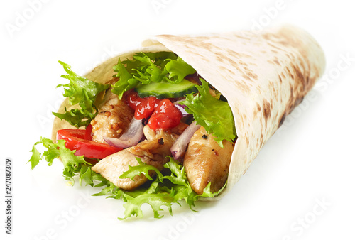 Tortilla wrap with fried chicken meat and vegetables