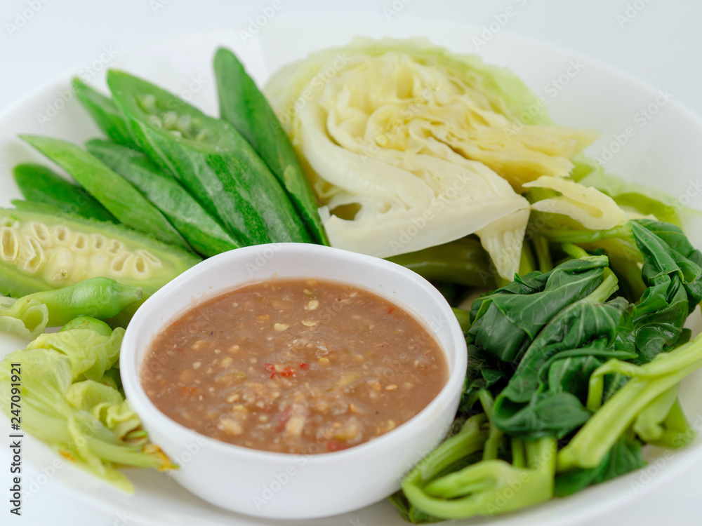 Thai cuisine nam prik or chili paste with various vegetables or with blanched vegetables, Thai Traditional Local Food on white background Thai cuisine nam prik or chili paste with various vegetables or with blanched vegetables, Thai Traditional Local Food on white background