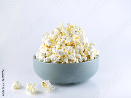 Popcorn in bowl isolated on white background