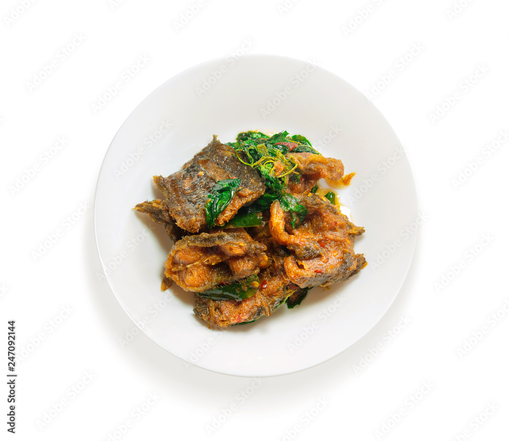 phad phed pla duk thod krob (stir fried deep fried catfish with curry paste), thai food. on white background