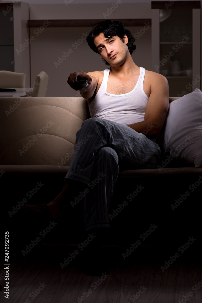 Young man suffering at home night time Young man suffering at home night time