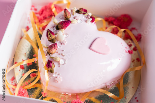 Cake with strawbery in the shape of heart on Valentine's Day