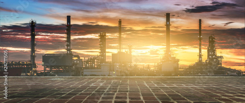 Oil refinery or petrochemical industry with ship at Sunset with Empty concrete floor. for Logistic Import Export background, Petroleum, petrochemical plant.