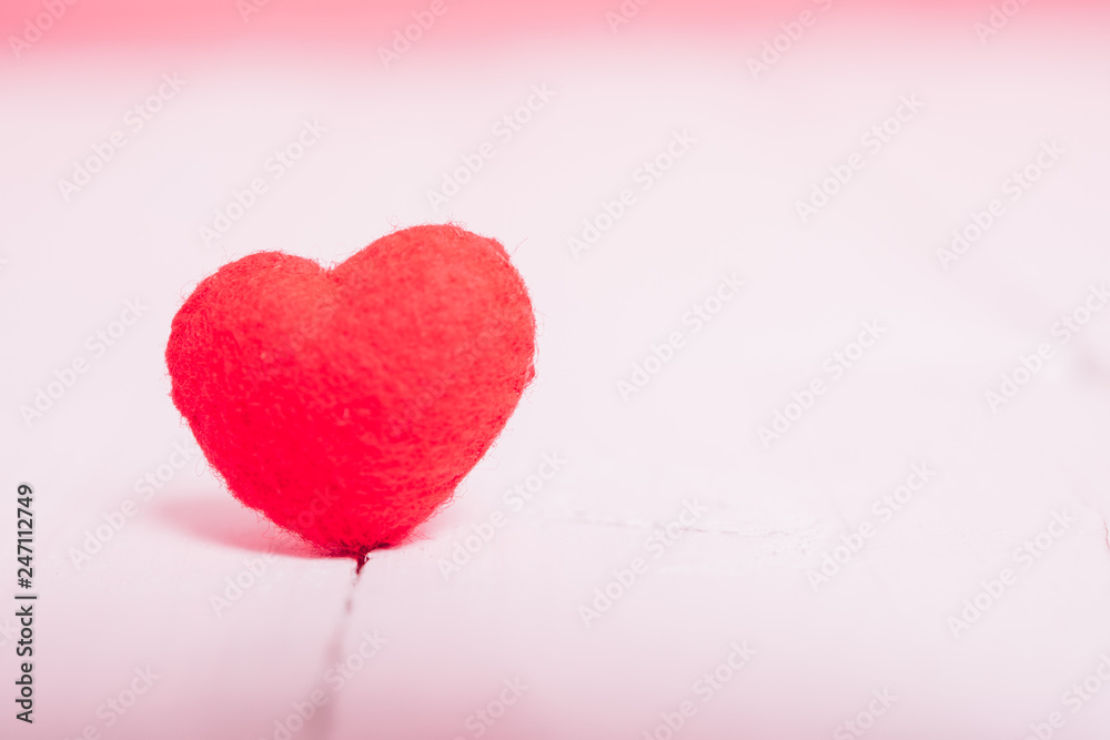 Red heart on white wooden have pink background