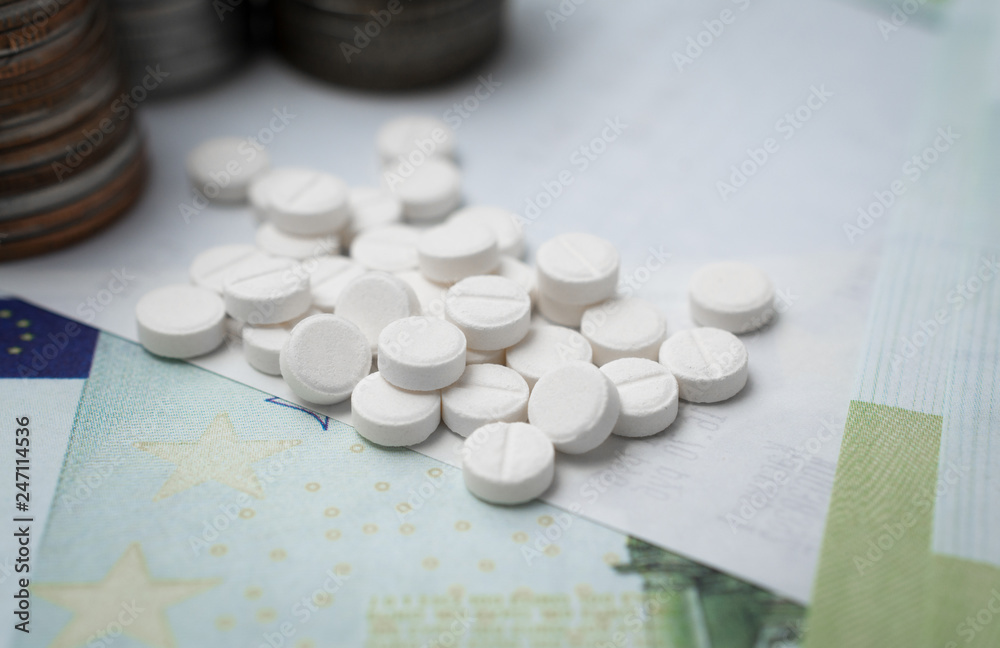 Pharmaceutical business abstract, white pills on a blue background Pharmaceutical business abstract, white pills on a blue background